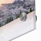 Large abstract wall art of the Rocky Mountains in vibrant blues and greens on acrylic glass.