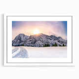 Abstract art print of the Rocky Mountains in muted blue and green tones on a framed white canvas.