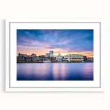 Abstract art print of Savannah scenery in muted green and blue tones, framed with a white mat.