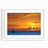 Abstract art print of Maui scenery in muted blue and green tones, framed with a white mat.