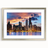Textured abstract art print of Chicago skyline in muted gray and blue tones, framed in silver.