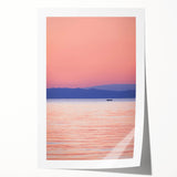 Rolled print of Lake Michigan, featuring soft blue and gray tones in a minimalist style.