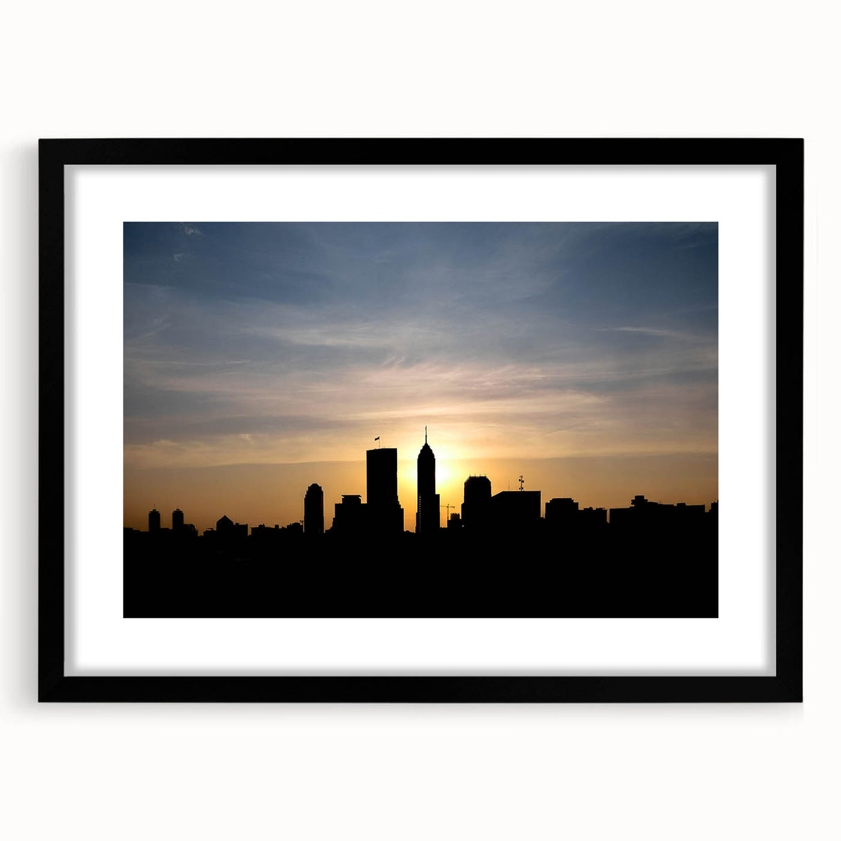 Abstract art print of Indianapolis skyline in vibrant colors on a large, framed canvas, ideal for living room decor.