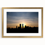 Extra large abstract art print of Indianapolis skyline in muted gray and blue tones, framed in gold.