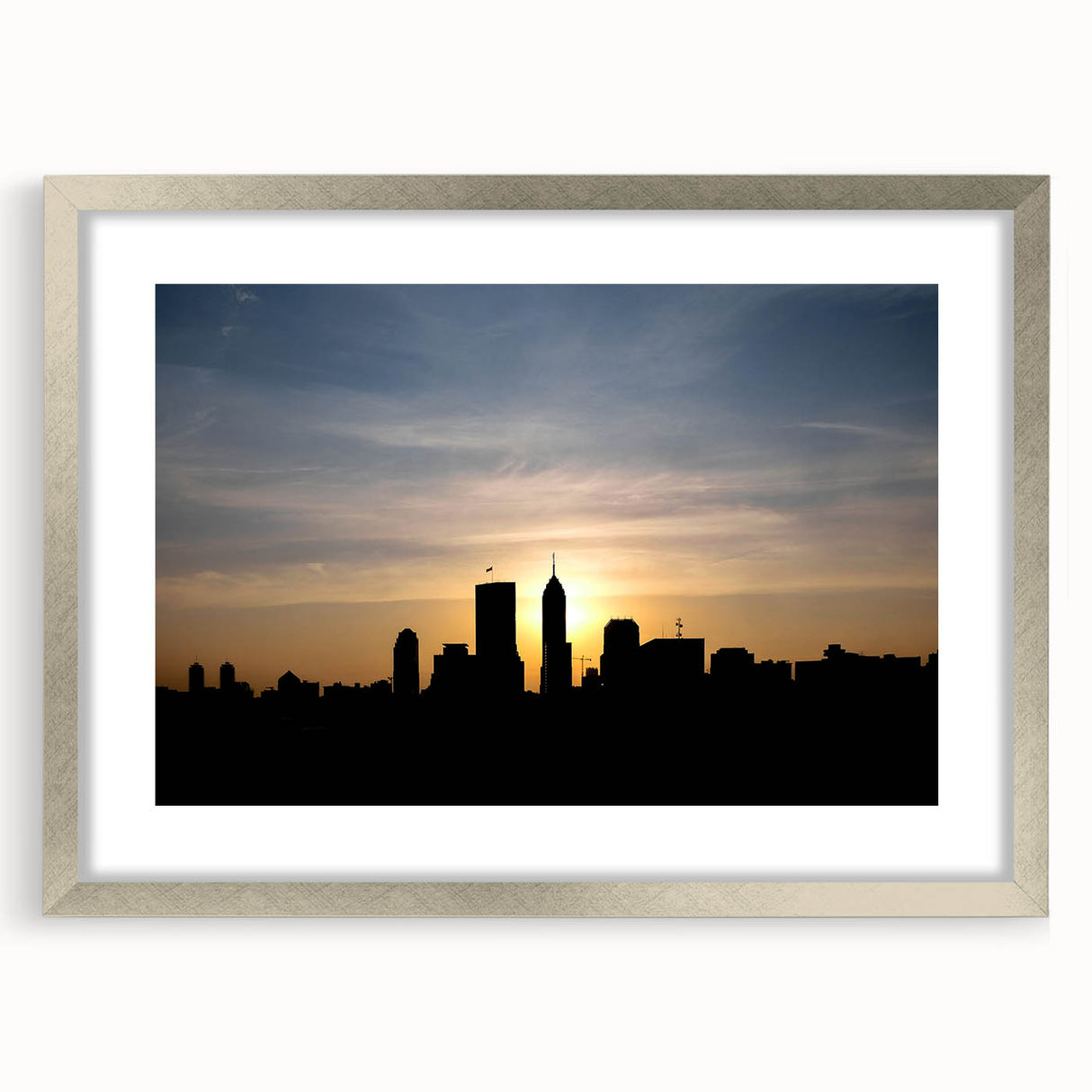 Textured art print of Indianapolis skyline, using abstract gray and blue tones on a framed silver mat.