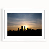 Abstract art print of Indianapolis skyline in muted gray and blue tones on a white framed canvas.