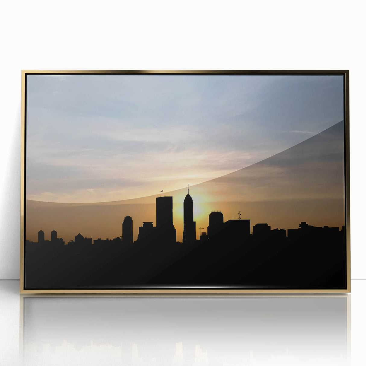 Acrylic print of Indianapolis skyline in muted gold tones, framed, in a mid-century modernist style.