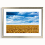 Textured abstract art print of Iowa scenery in muted earth tones on a silver-framed mat, ideal for bedroom art.