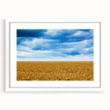 Abstract art print of Iowa scenery in muted earth tones on a white matted frame, suitable for dining room decor.