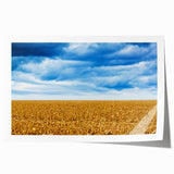Rolled print of Iowa scenery with vibrant green fields and a blue sky, ideal for dining room wall art.