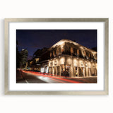Textured art print of abstract New Orleans cityscape in muted gray and silver hues, framed with a silver mat.