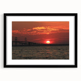 Colorful abstract art print of Annapolis scenery in vibrant hues on a black framed mat, ideal for living room decor.