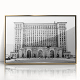 Large art print of Detroit skyline in mid-century modernist style, with muted gray and gold tones on acrylic framed material.