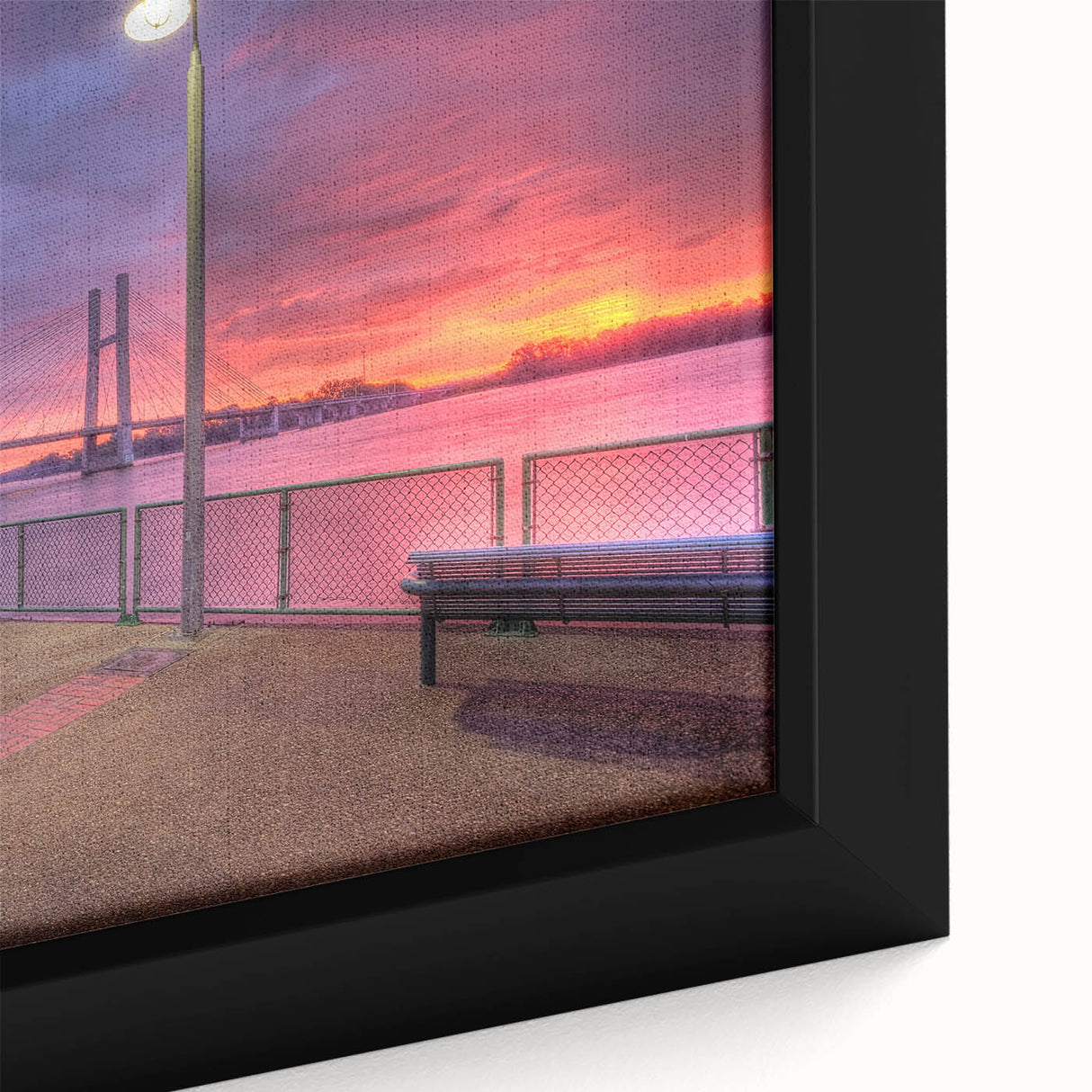 Close-up of a textured black wall art featuring a colorful Mississippi scenery on a framed canvas.
