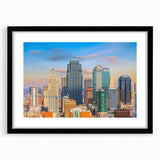 Abstract art print of Kansas City with vibrant, colorful textures on a large framed canvas, ideal for living room decor.