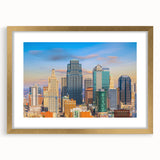 Extra large abstract art print of Kansas City skyline, with textured strokes in gold and black, framed with a mat.