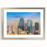Textured art depicting an abstract Kansas City skyline in muted gray tones on a framed silver mat.
