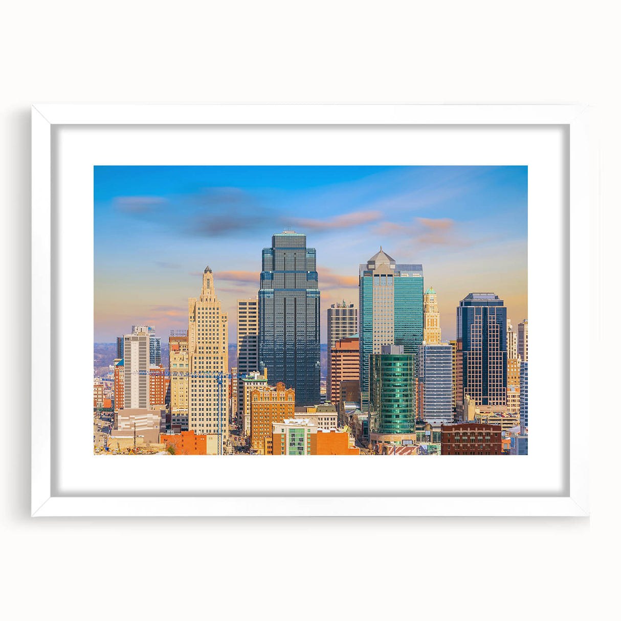 Abstract art print of Kansas City skyline in muted gray and blue tones on a white framed poster.