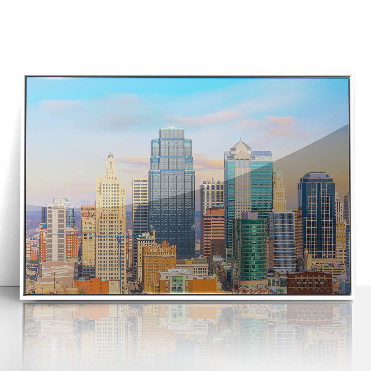 Acrylic print of Kansas City skyline in muted grays and blues, framed in white, suitable for modern nursery decor.