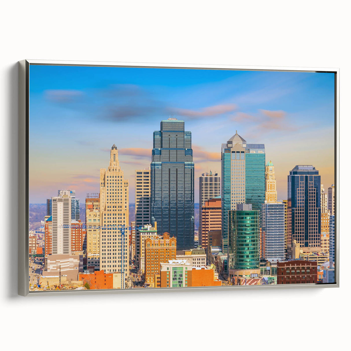 Framed canvas landscape art painting depicting the Kansas City skyline in vibrant colors on a black background.