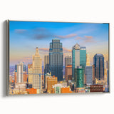 Framed canvas landscape art painting depicting the Kansas City skyline in vibrant colors on a black background.