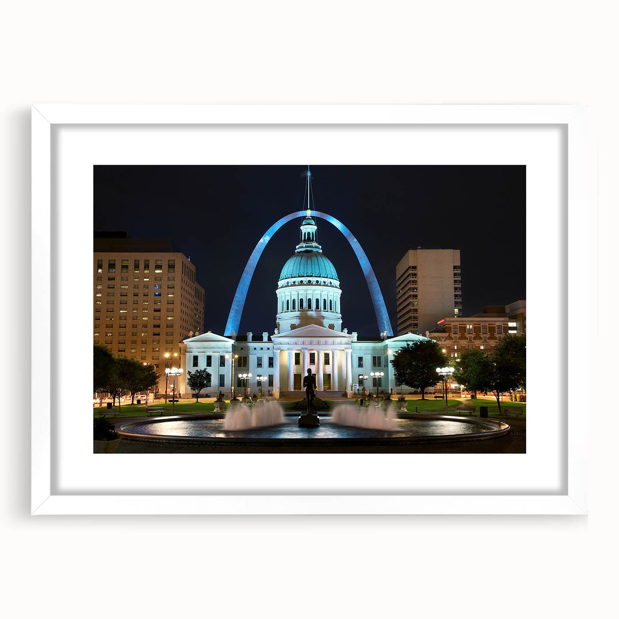 Abstract art print of St. Louis skyline in muted gray and blue tones on a framed white mat, suitable for dining room decor.