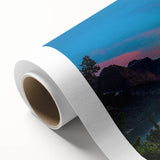 Art deco poster of Glacier National Park on rolled canvas, featuring cool blue and green tones.