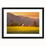 Abstract art print featuring textured, colorful art of Montana scenery in a large black frame, ideal for living room decor.