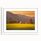 Abstract art print of Montana scenery in muted earth tones on a framed white mat, suitable for bedroom or dining room decor.