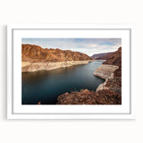 Abstract art print of Hoover Dam in muted gray and blue tones, framed with a white mat, ideal for dining room decor.