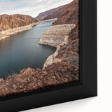 Close-up of a black wall art featuring textured, colorful Hoover Dam scenery on a framed canvas.