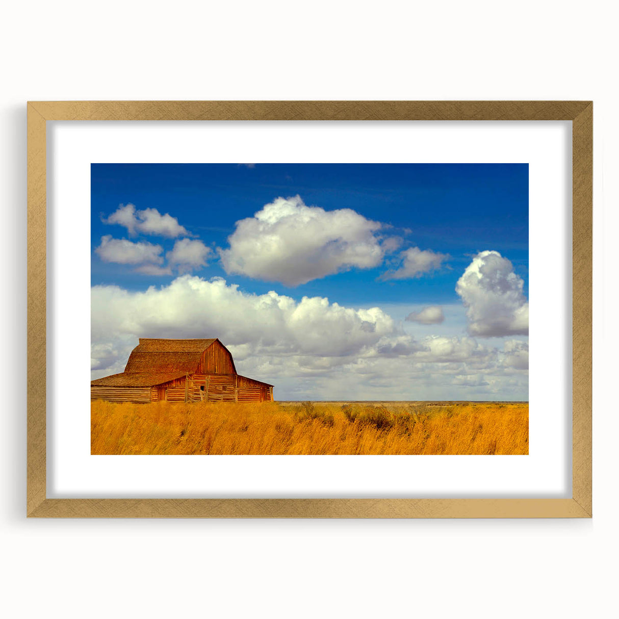 Extra large abstract art print of a textured New Mexico landscape in muted earth tones, framed in gold.