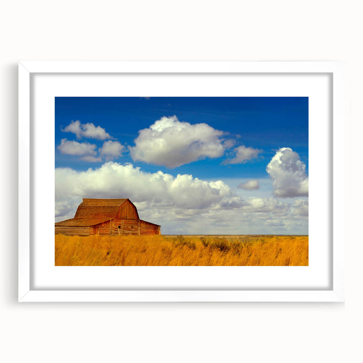 Abstract art print of New Mexico scenery in muted earth tones on a framed white mat, suitable for dining room decor.
