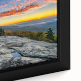 Close-up of textured black wall art depicting the Blue Ridge in North Carolina, with vibrant colors on a framed canvas.