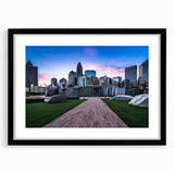 Extra large abstract art print of colorful, textured Charlotte skyline on black framed canvas, ideal for living room decor.