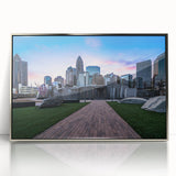 Mid-century modernist art depicting Charlotte skyline in muted blue tones on a framed acrylic.