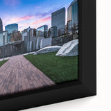 Extra large framed canvas of a textured Charlotte skyline in black with colorful accents, ideal for living room decor.