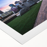 Art deco poster of Charlotte skyline in muted metallic tones on rolled canvas, suitable for dining room decor.