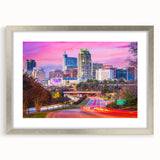 Textured abstract art print of Raleigh skyline in muted gray tones on a framed canvas, ideal for modern bedroom ambiance.