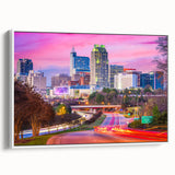 Vintage poster art of Raleigh, North Carolina on a framed canvas, featuring colorful art in a large format.