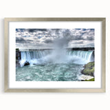 Textured art print of Niagara Falls in abstract style with muted blue and gray tones, framed in silver.