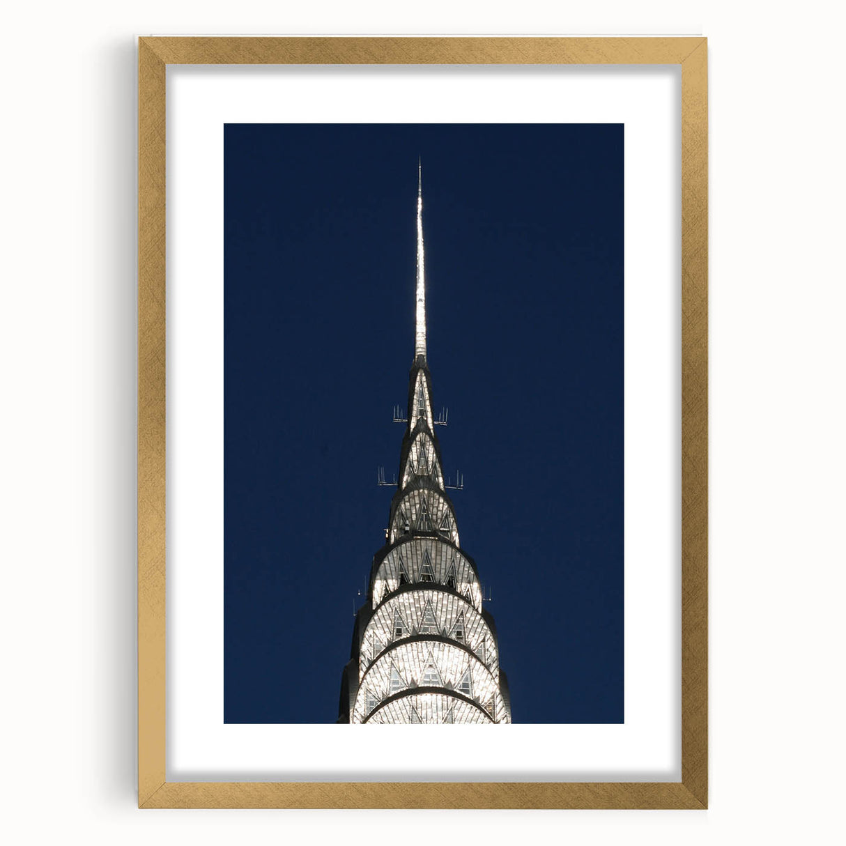 Extra large framed wall art featuring an abstract depiction of the Chrysler Building in textured gold and black tones.