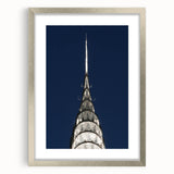 Textured art print of the Chrysler Building in muted gray tones on a framed silver canvas, ideal for bedroom art.