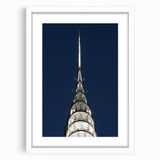 Abstract art print of the Chrysler Building in muted gray tones on a framed white mat.