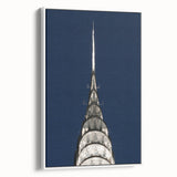 Vintage poster art of the Chrysler Building in muted black and gray tones on a framed canvas, ideal for living room decor.