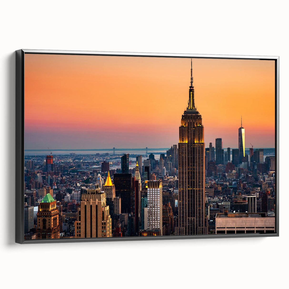 Black and white wall art featuring a vintage poster of the NYC Empire State Building on a framed canvas.