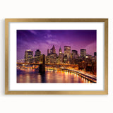 Extra large abstract art print of Manhattan skyline in muted gray and gold tones on a framed canvas.