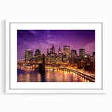 Abstract art print of Manhattan skyline in muted gray and blue tones, framed with a white mat.