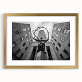 Extra large abstract art print of Rockefeller skyline, featuring textured gold matting, ideal for living room decor.
