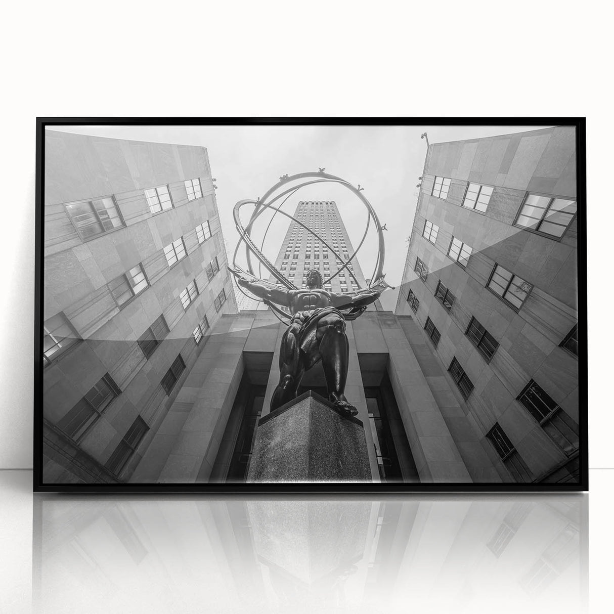 Large abstract wall art depicting New York City's Rockefeller Center in muted black and gray tones on framed acrylic.